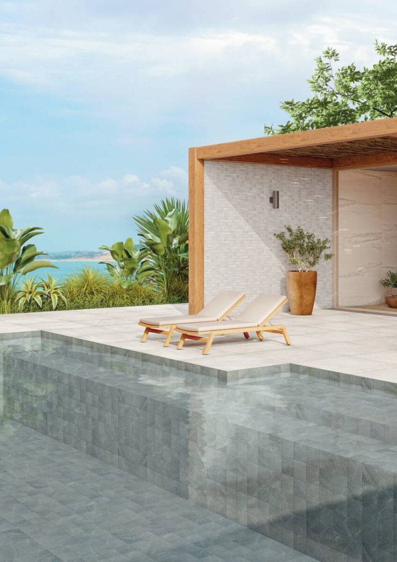 Versatilidade do porcelanato, usado no deck e no interior da piscina, criando um visual diferenciado e com mais facilidade de limpeza e manutenção no dia a dia