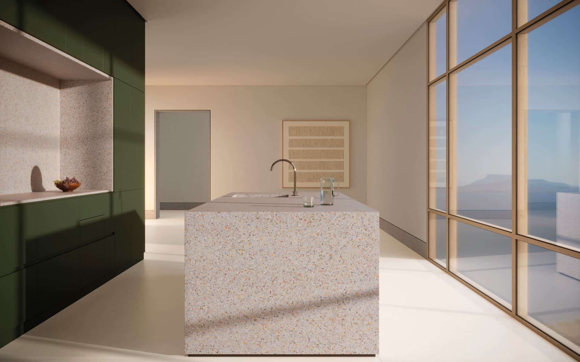 Cozinha em tom cru, com destaque para marcenaria verde e ilha com pontos coloridos